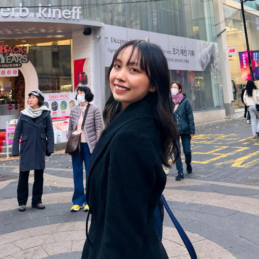 An image of a young woman at a historic site.